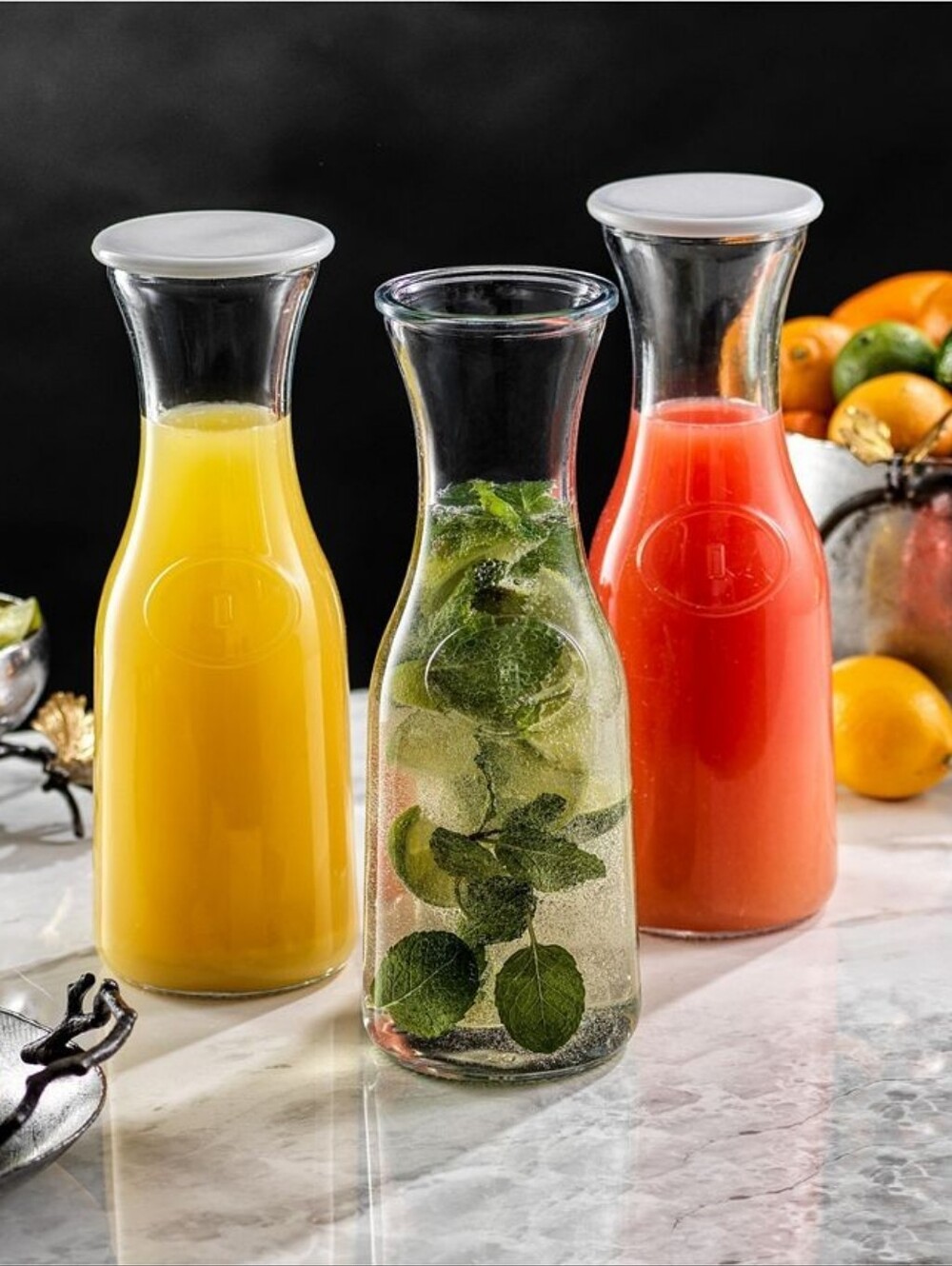 Joyjolt Hali Glass Carafe Bottle Pitcher with 6 Lids - 36 Oz - Set of 3
